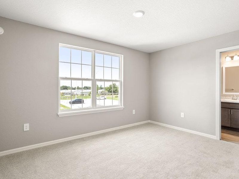 Large secondary bedrooms provide space for everyone in your household - Bimini townhome by Highland Homes