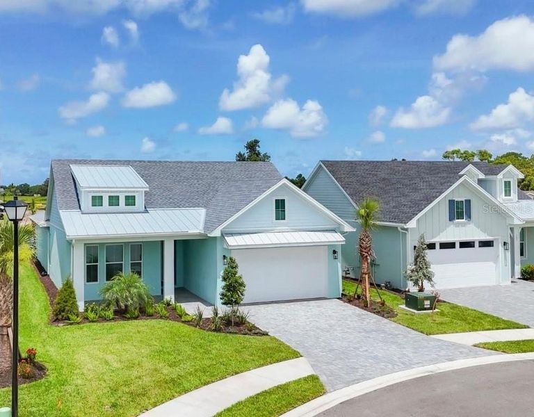 Front exterior of a new home in Gracewater at Sarasota, Sarasota, FL, highlighting curb appeal (Image 28).