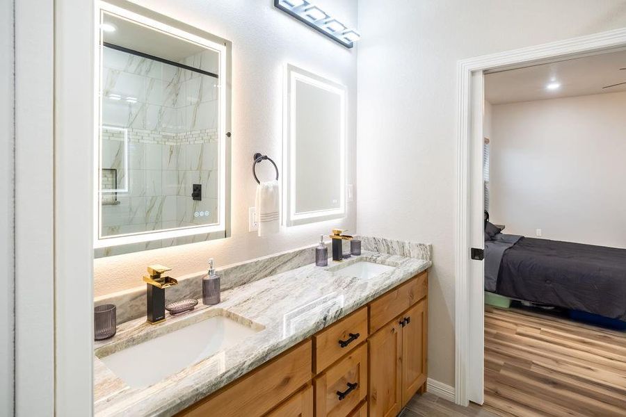 Bathroom with vanity and hardwood / wood-style flooring