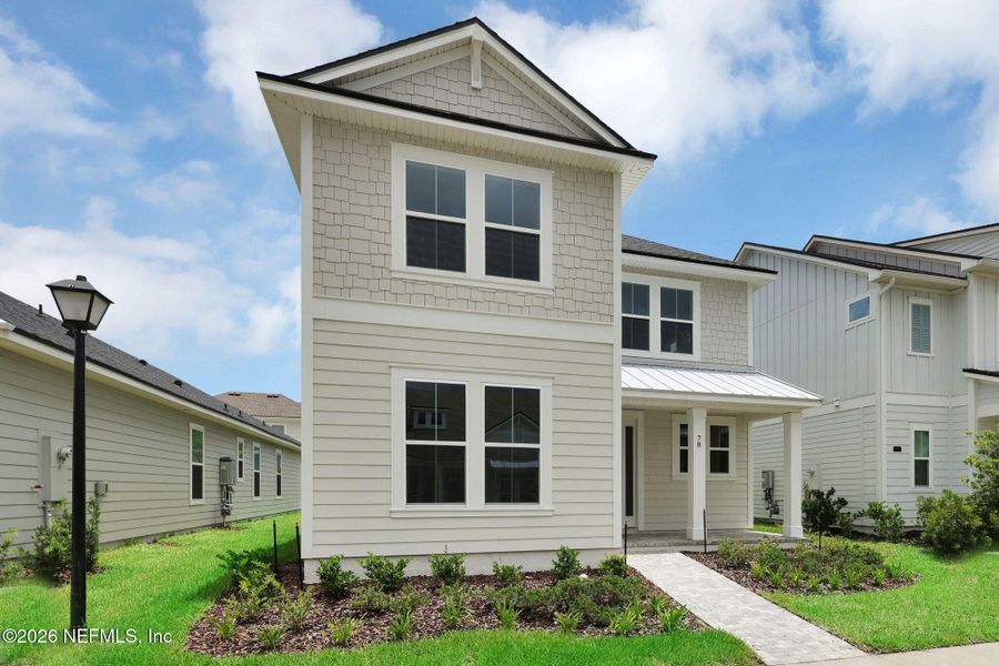 Front exterior of a new home in Seabrook Village at Seabrook, Nocatee, FL, highlighting curb appeal (Image 21).