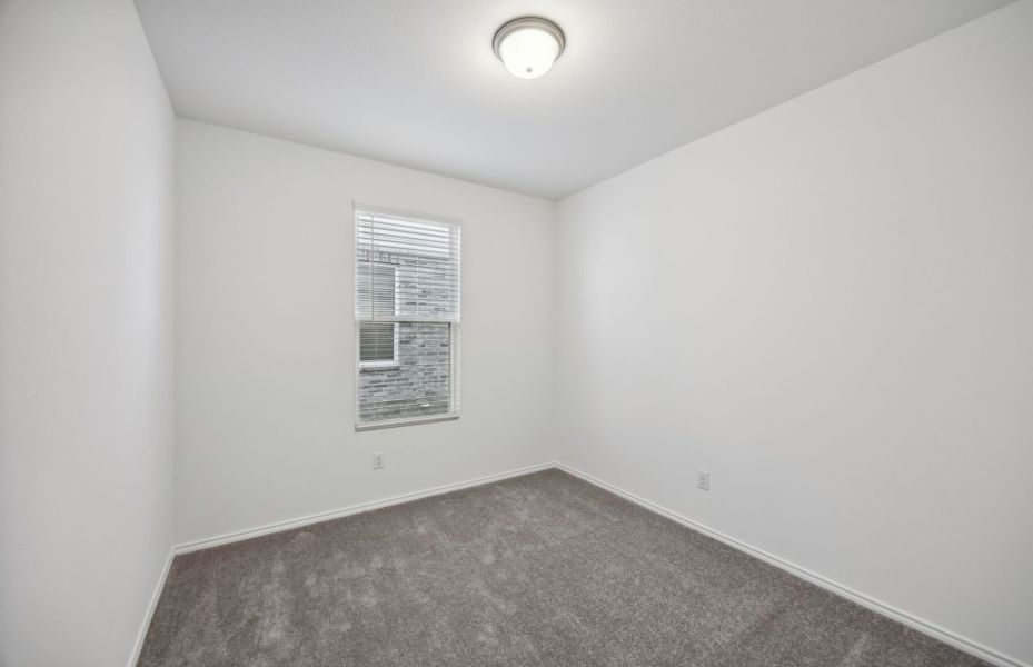 Spacious secondary bedroom with ample closet space *real home pictured