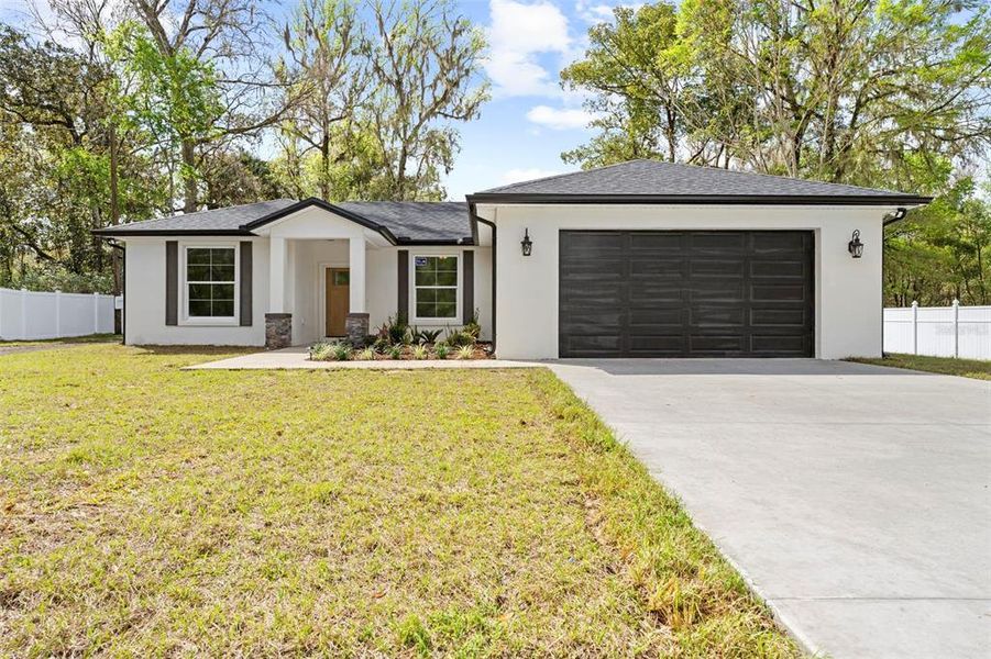 Front exterior of a new home in , Brooksville, FL, highlighting curb appeal (Image 19).