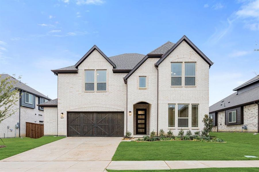 Front exterior of a new home in Windsong Ranch Classic 61, Prosper, TX, highlighting curb appeal (Image 22).