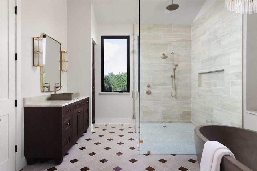 Luxury in every detail. The primary bathroom is anchored by a stunning custom concrete soaking tub and a walk-in shower with a limestone surround. This spa-like environment uses natural textures to create a calming, high-end atmosphere that feels like a private getaway.