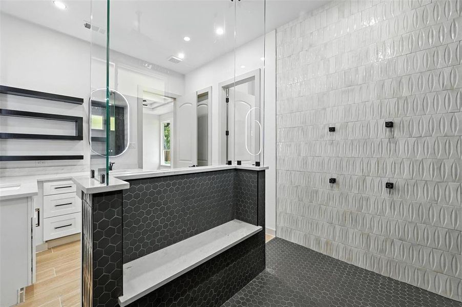 Full bathroom featuring vanity, a walk in shower, tile walls, and recessed lighting Full bathroom featuring vanity, a walk in shower, tile walls, and recessed lighting