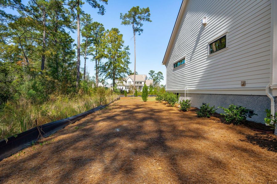 Exterior details and patio area of a home in , Ravenel (Image 34).