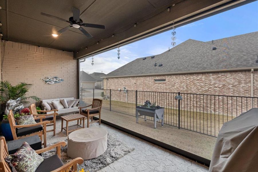 Best back patio ever!  Has the gorgeous concrete stamped flooring and retracrable shade to protect you from mostquitos and bugs!