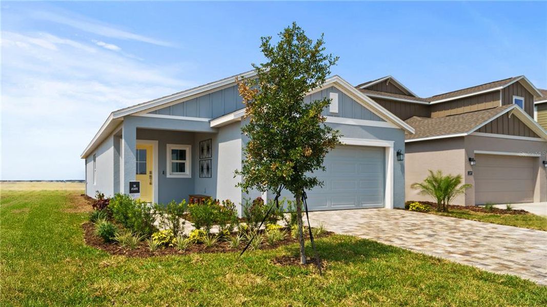 Front exterior of a new home in Hamilton Bluff, Haines City, FL, highlighting curb appeal (Image 23).