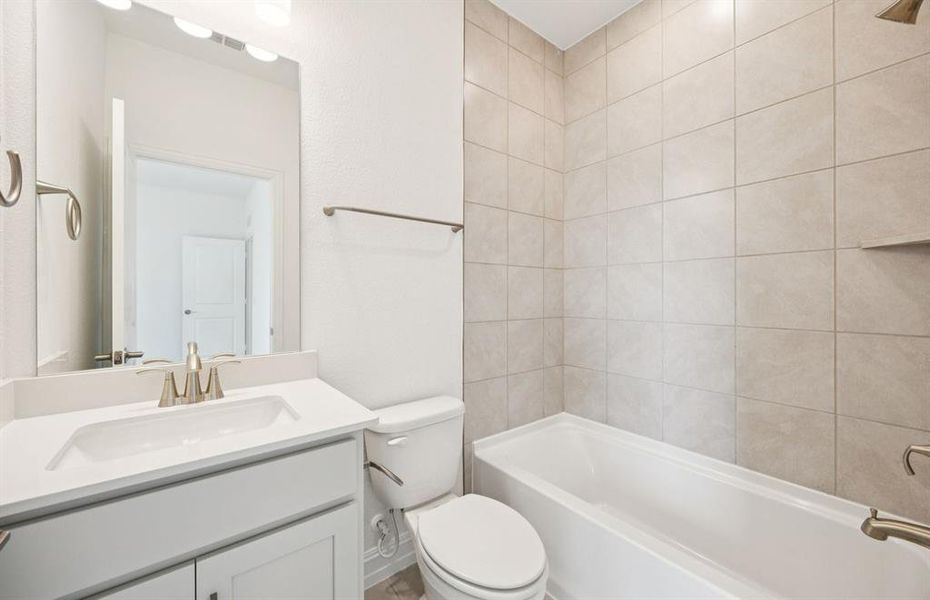 Secondary bathroom featuring modern upgrades and finishes *Model representation Secondary bathroom featuring modern upgrades and finishes *Model representation