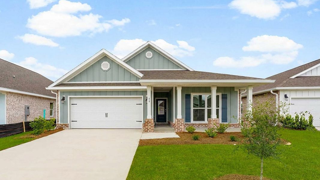 Front exterior of a new home in Owl's Head Farms, Freeport, FL, highlighting curb appeal (Image 1). Front exterior of a new home in Owl's Head Farms, Freeport, FL, highlighting curb appeal (Image 1).