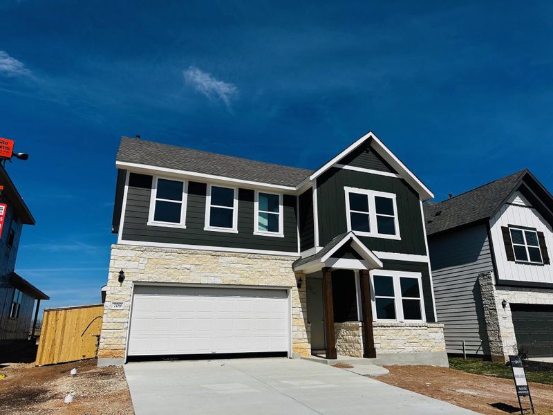 Front exterior of a new home in Patterson Ranch, Georgetown, TX, highlighting curb appeal (Image 9).