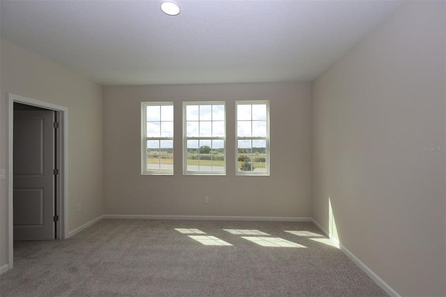 Spacious, unfurnished interior of a new home in Lake Star at Ovation, Winter Garden (Image 28).