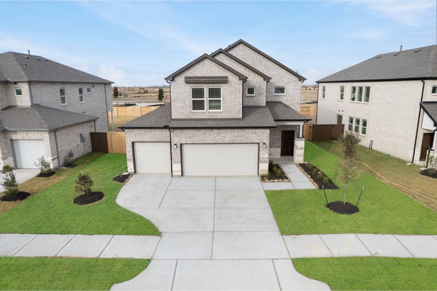 Front exterior of a new home in Creekhaven, Iowa Colony, TX, highlighting curb appeal (Image 1). Front exterior of a new home in Creekhaven, Iowa Colony, TX, highlighting curb appeal (Image 1).