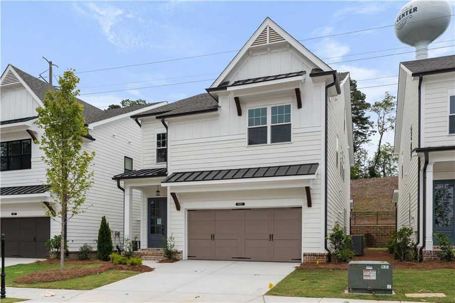 Front exterior of a new home in Palisades Single Family, Cumming, GA, highlighting curb appeal (Image 27).