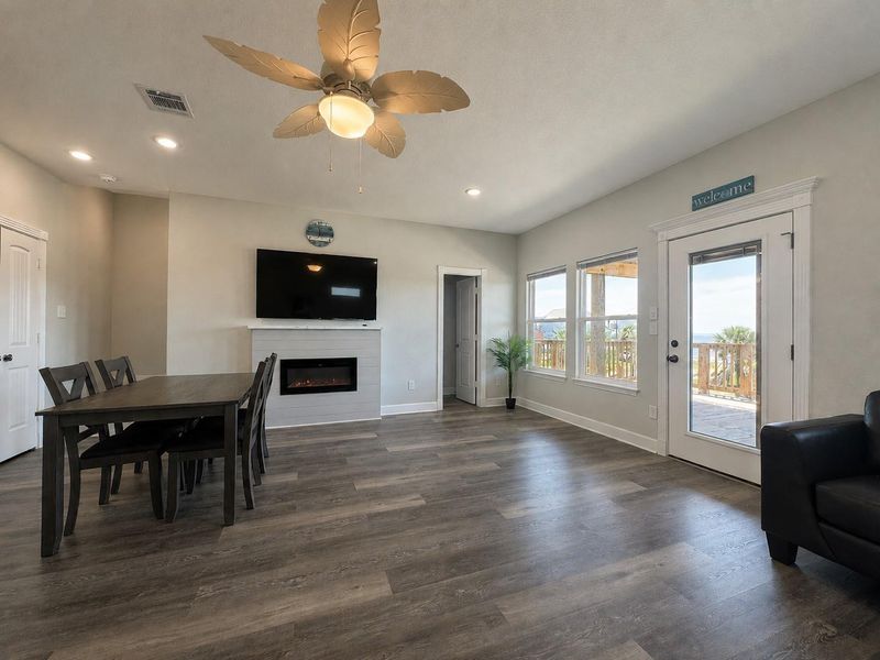 Room has beach views out of the windows! Filled with Natural Light and has an electric fireplace.
