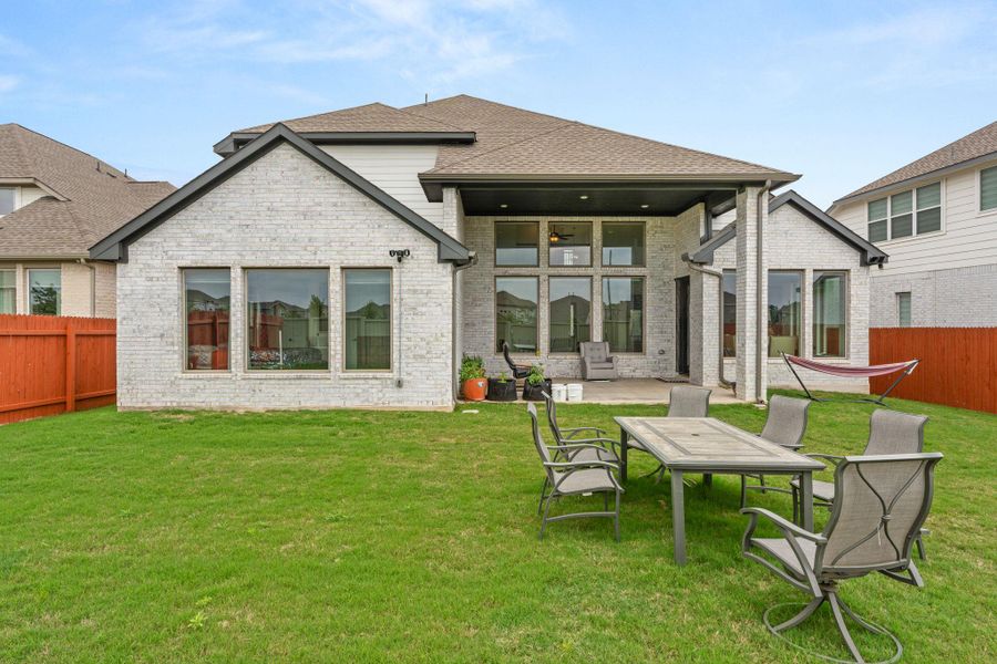 Exterior details and patio area of a home in Santa Rita Ranch, Liberty Hill (Image 25).