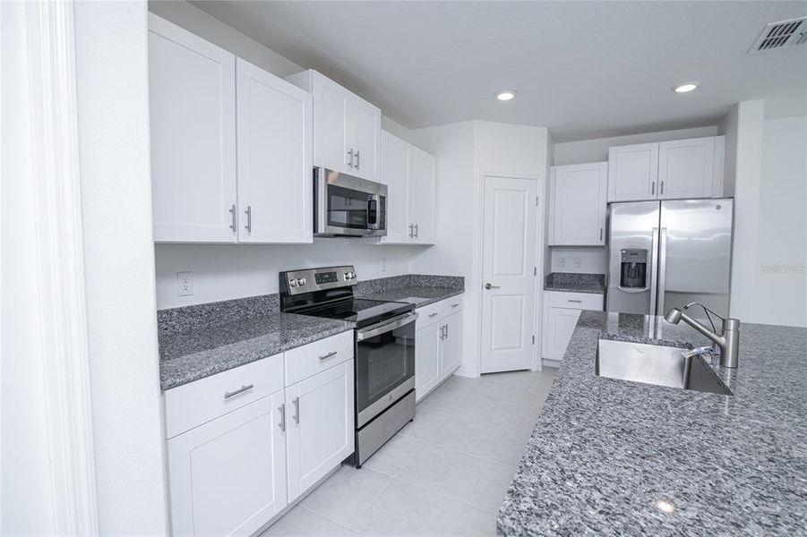 Furnished interior view inside a new home in Saddle Creek Preserve: The Manors II, Lakeland (Image 36).