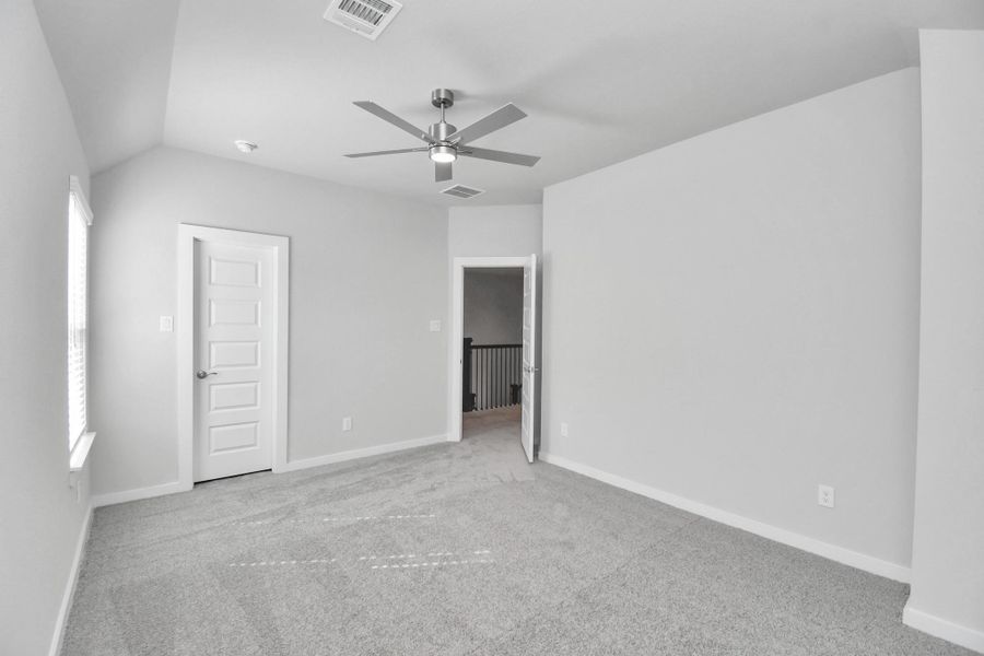 Generously sized secondary bedrooms featuring spacious closets, soft and inviting carpeting underfoot, large windows allowing plenty of natural light, and the added touch of privacy blinds for your personal retreat.
