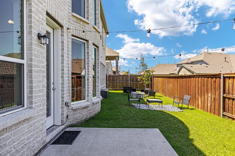 View of yard with a patio area and an outdoor living space