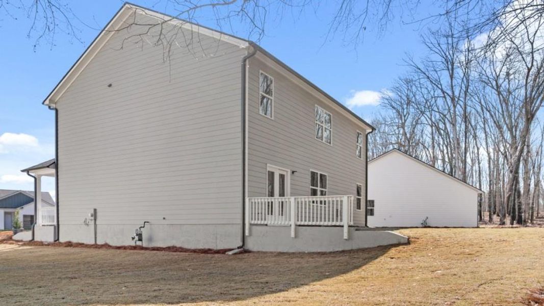Exterior details and patio area of a home in Liberty Crossing, Braselton (Image 4).