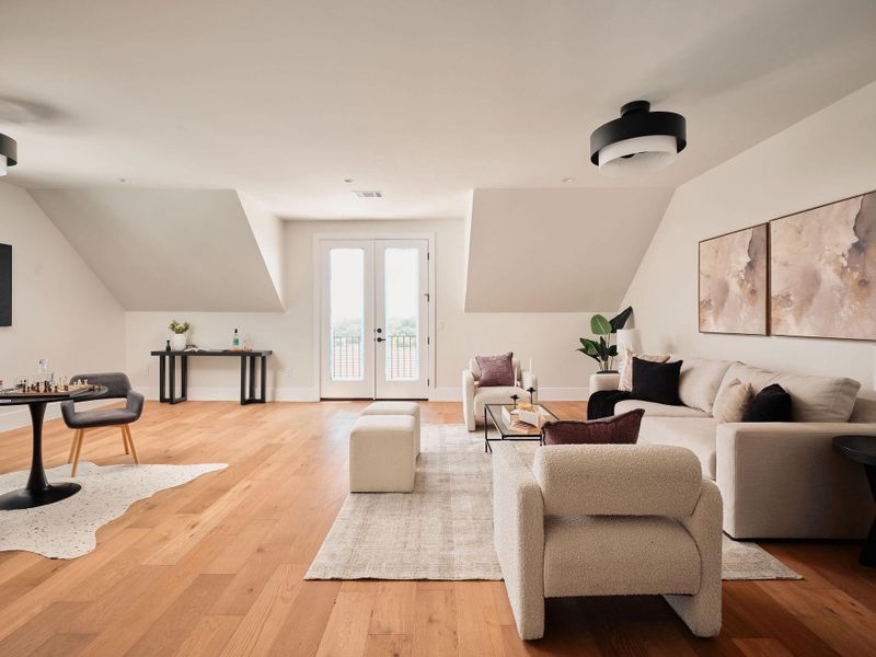 Hardwood floors and generous natural light define this inviting open-concept living space. Hardwood floors and generous natural light define this inviting open-concept living space.