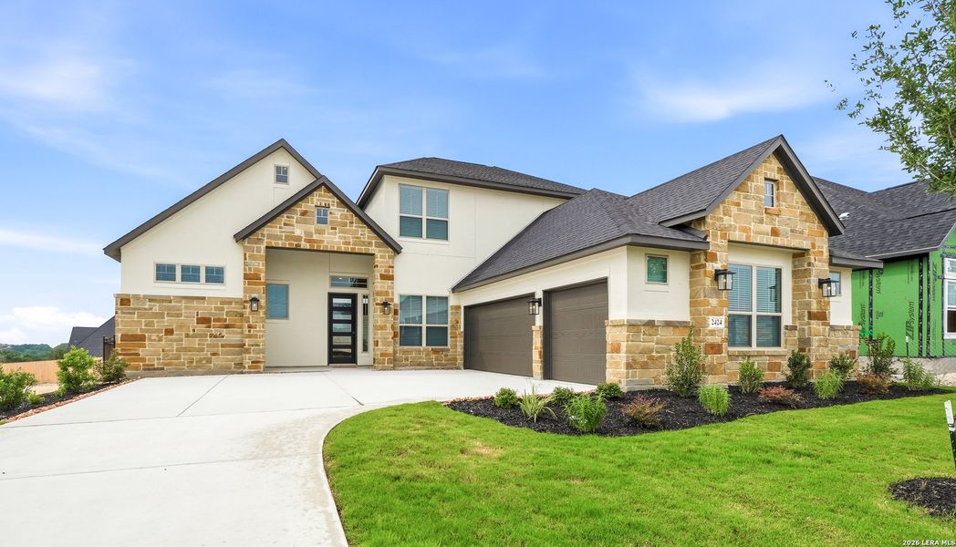 Front exterior of a new home in Prominence Urban, San Antonio, TX, highlighting curb appeal (Image 26).