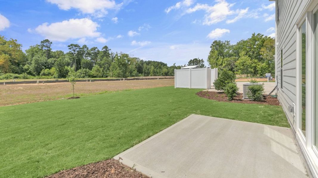 Exterior details and patio area of a home in Wilson's Ridge, Wilson's Mills (Image 1).