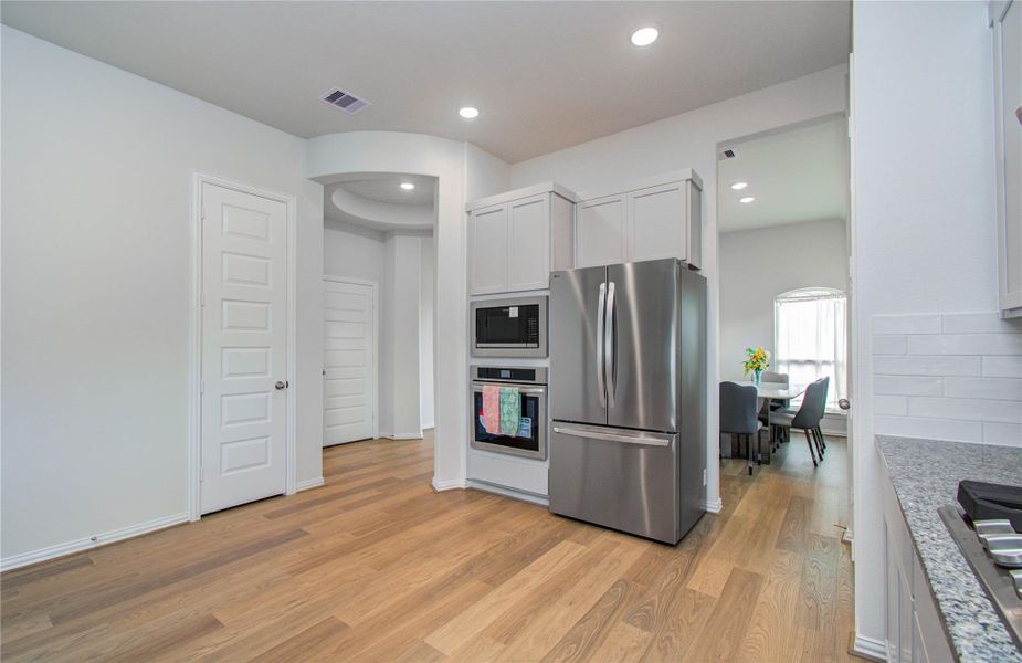 Furnished interior view inside a new home in Sunterra, Katy (Image 21).