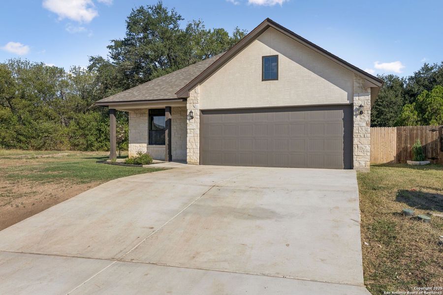Front exterior of a new home in , Seguin, TX, highlighting curb appeal (Image 1).