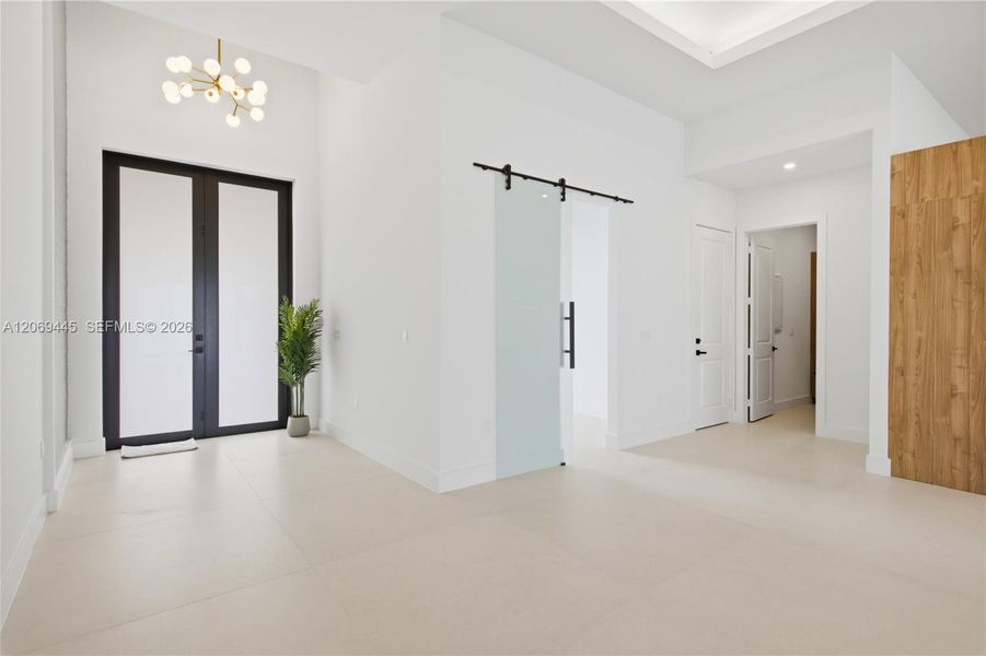 Discover inside w/ 48x48 designer porcelain tile throughout, soaring ceilings w/ tray & wood accents, abundant natural light, impact windows & doors & clean contemporary lines that define every space! Discover inside w/ 48x48 designer porcelain tile throughout, soaring ceilings w/ tray & wood accents, abundant natural light, impact windows & doors & clean contemporary lines that define every space!