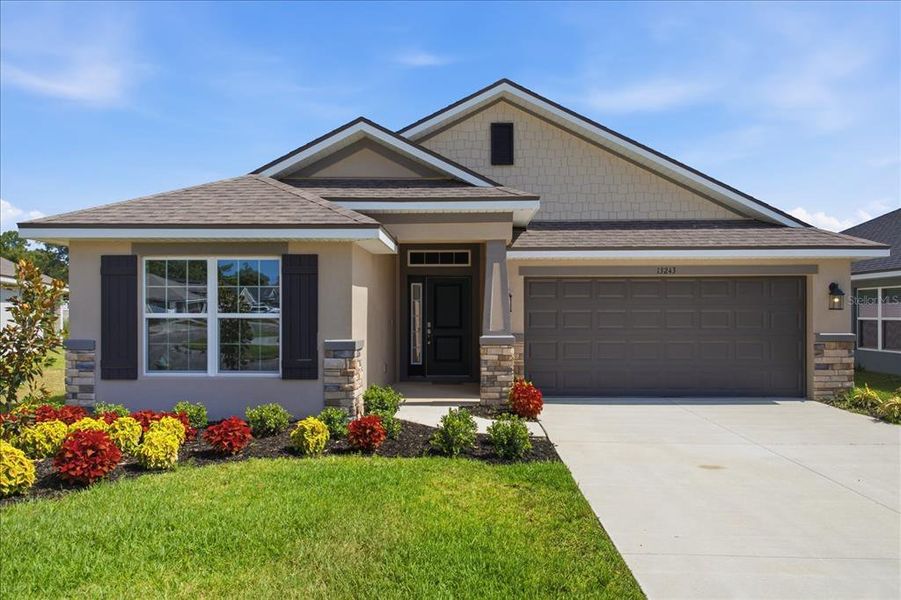 Front exterior of a new home in Abbey Glen, Dade City, FL, highlighting curb appeal (Image 25).