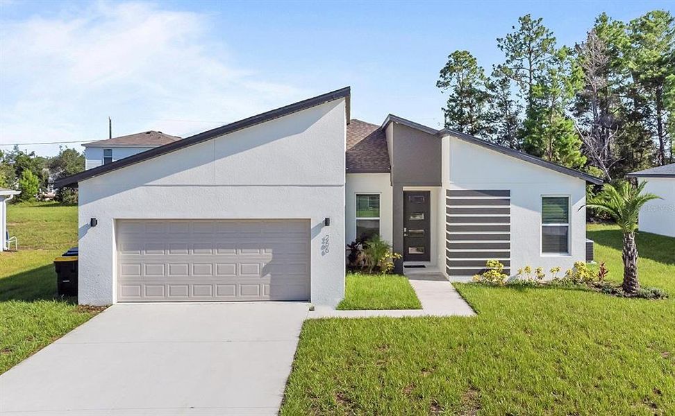Front exterior of a new home in , Kissimmee, FL, highlighting curb appeal (Image 19).
