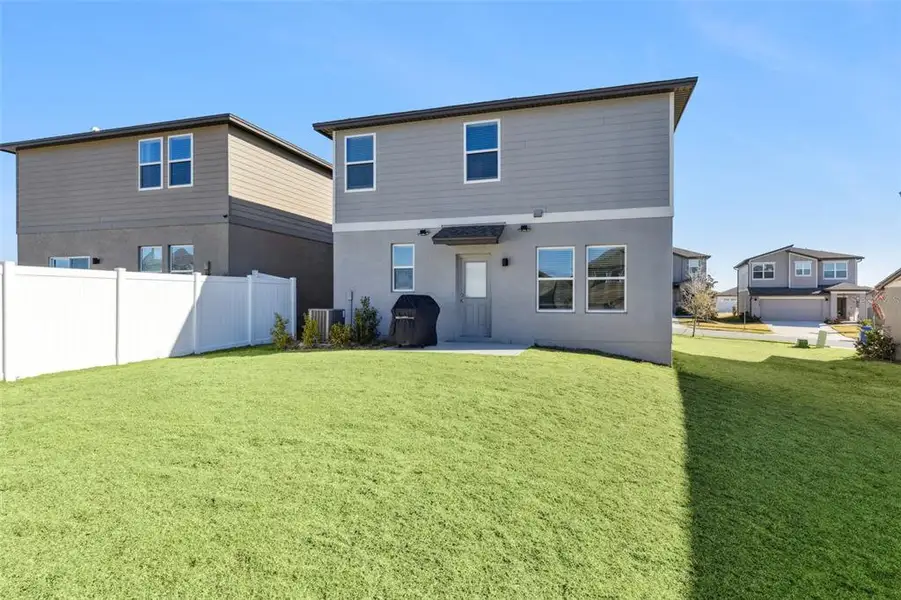 Exterior details and patio area of a home in Hills of Minneola, Minneola (Image 4).