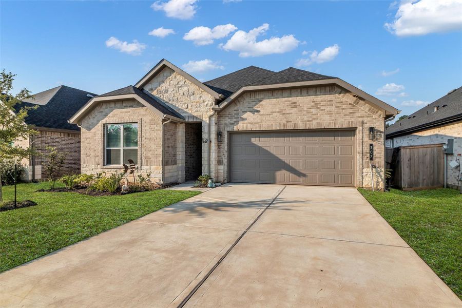 Front exterior of a new home in , Conroe, TX, highlighting curb appeal (Image 2).