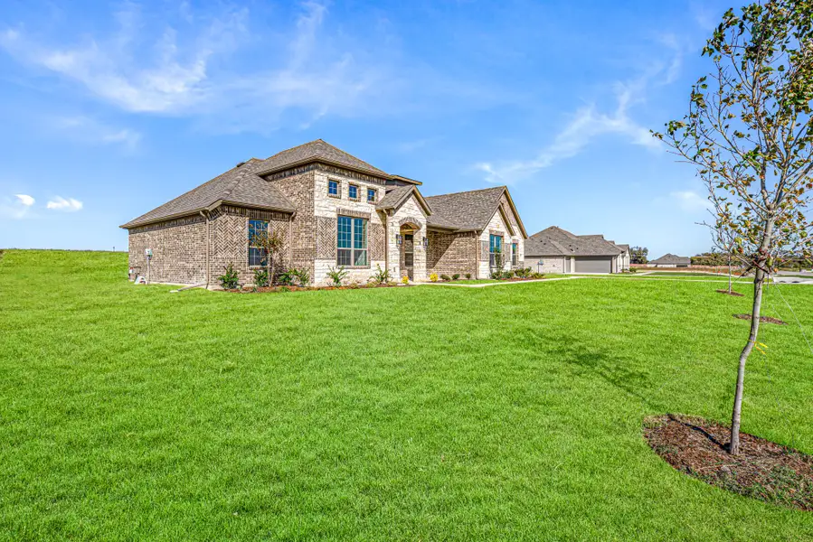 Front exterior of a new home in Levante, Waxahachie, TX, highlighting curb appeal (Image 23).