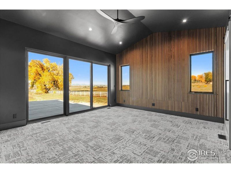 Primary bedroom w/ accoustical wall paneling