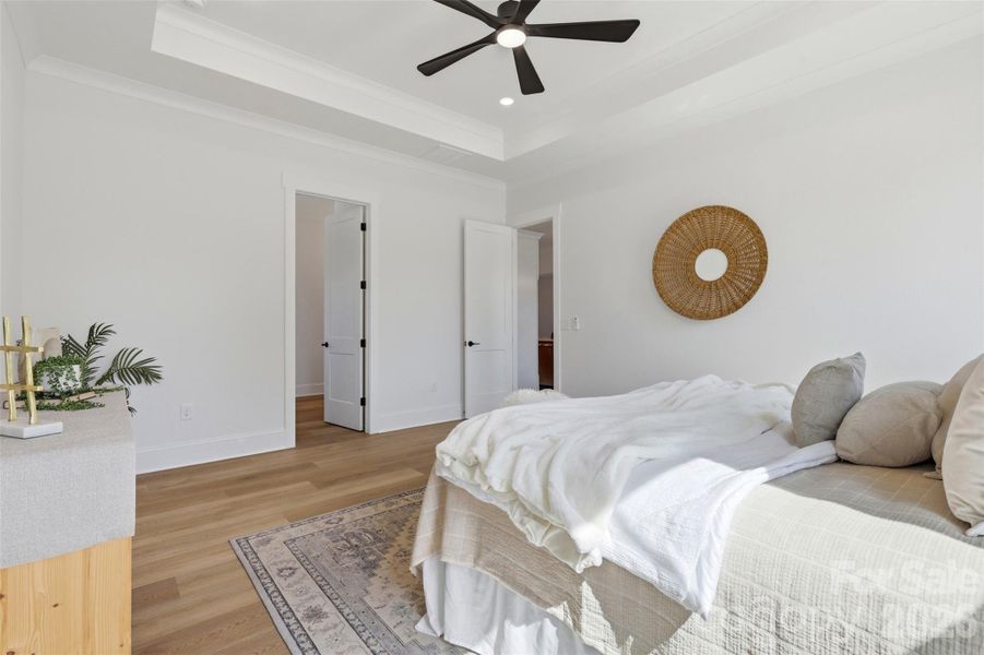 *representative photo- primary bedroom w/ tray ceiling, ensuite bathroom