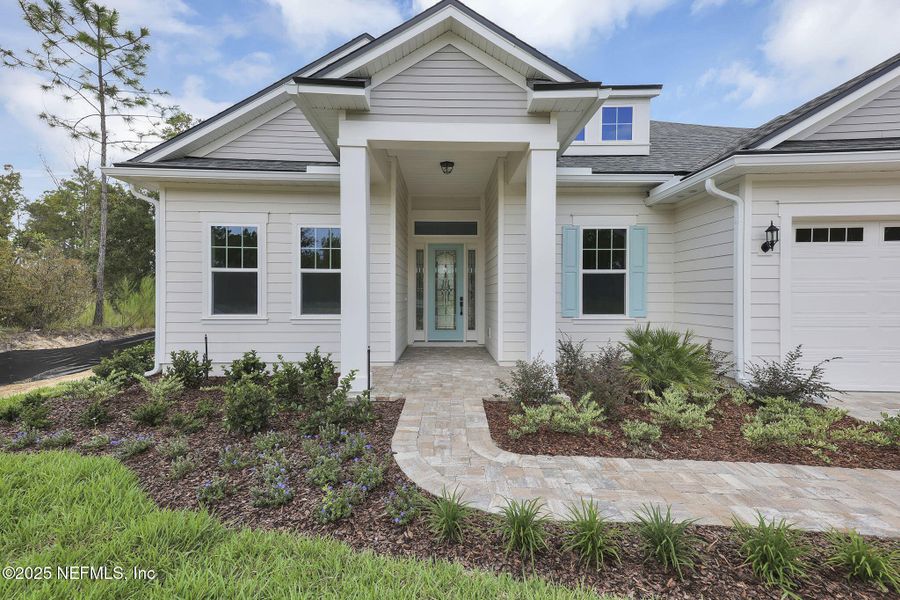 Front exterior of a new home in Hidden Creek at SilverLeaf, St. Augustine, FL, highlighting curb appeal (Image 19).