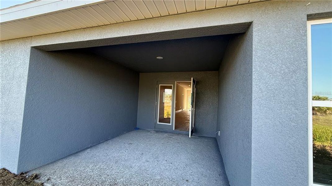 Exterior details and patio area of a home in Watercress Cove, North Port (Image 2).