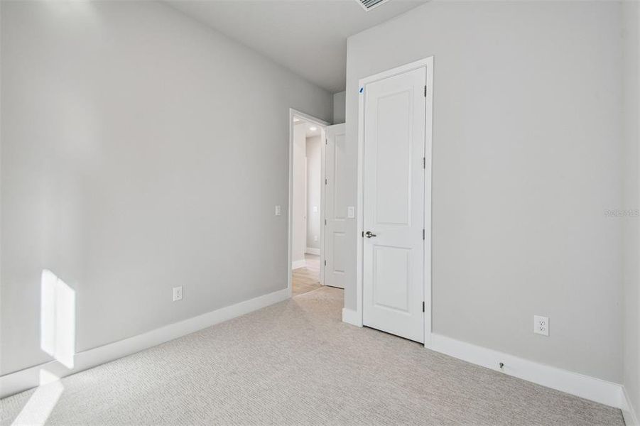 Spacious, unfurnished interior of a new home in Emerald Landing at Waterside at Lakewood Ranch – Cottage Series, Sarasota (Image 22). Spacious, unfurnished interior of a new home in Emerald Landing at Waterside at Lakewood Ranch – Cottage Series, Sarasota (Image 22).