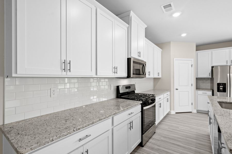 Furnished interior view inside a new home in Cypress Ridge - The Coastline Series, Longs (Image 8).