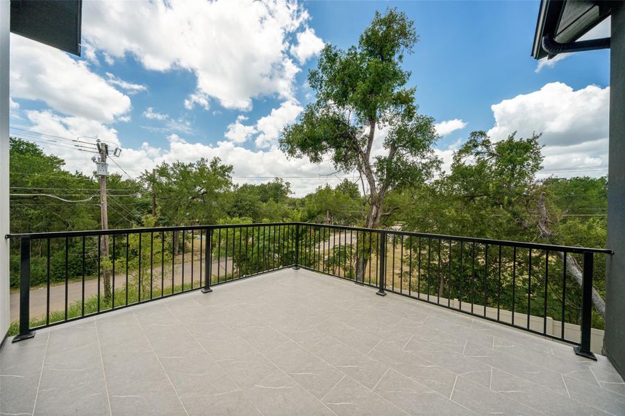 An inviting private balcony provides elevated views of the natural landscape and neighborhood surroundings. An inviting private balcony provides elevated views of the natural landscape and neighborhood surroundings.
