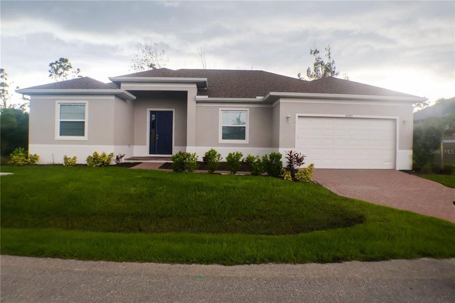 Front exterior of a new home in , Port Charlotte, FL, highlighting curb appeal (Image 2).