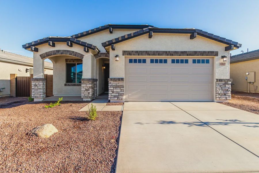Front exterior of a new home in Avanti at Granite Vista, Waddell, AZ, highlighting curb appeal (Image 17).