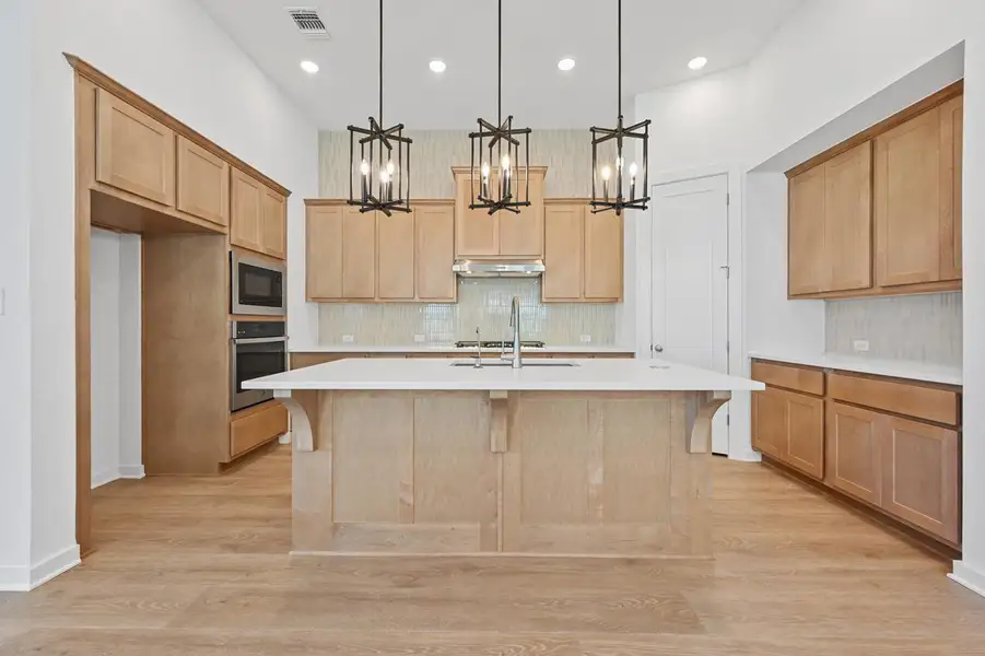 Furnished interior view inside a new home in 6 Creeks at Waterridge, Kyle (Image 8).