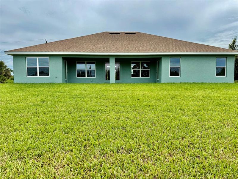 Front exterior of a new home in South Gulf Cove, Port Charlotte, FL, highlighting curb appeal (Image 1).