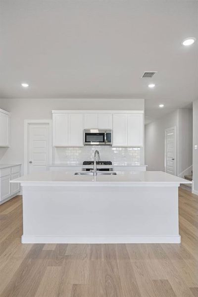 Kitchen in the Masters home plan by Trophy Signature Homes – REPRESENTATIVE PHOTO