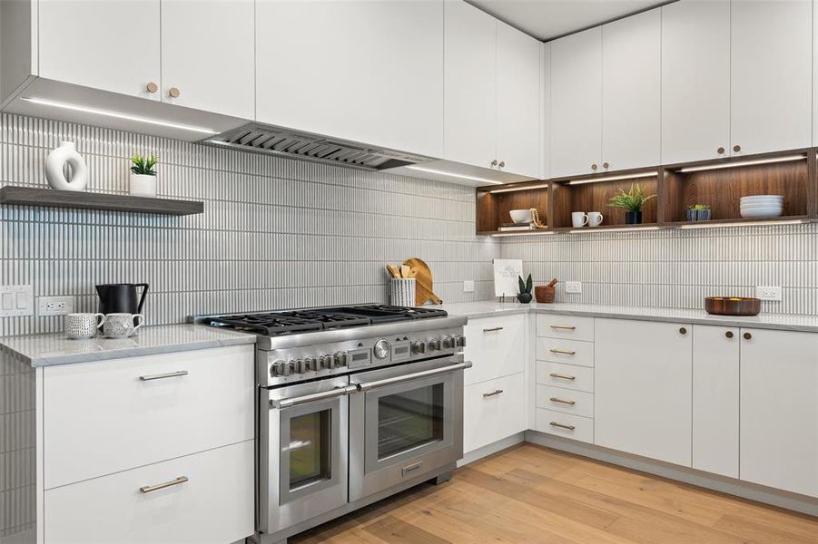 A glimpse into the modern kitchen adorned with sleek lines and contemporary finishes.