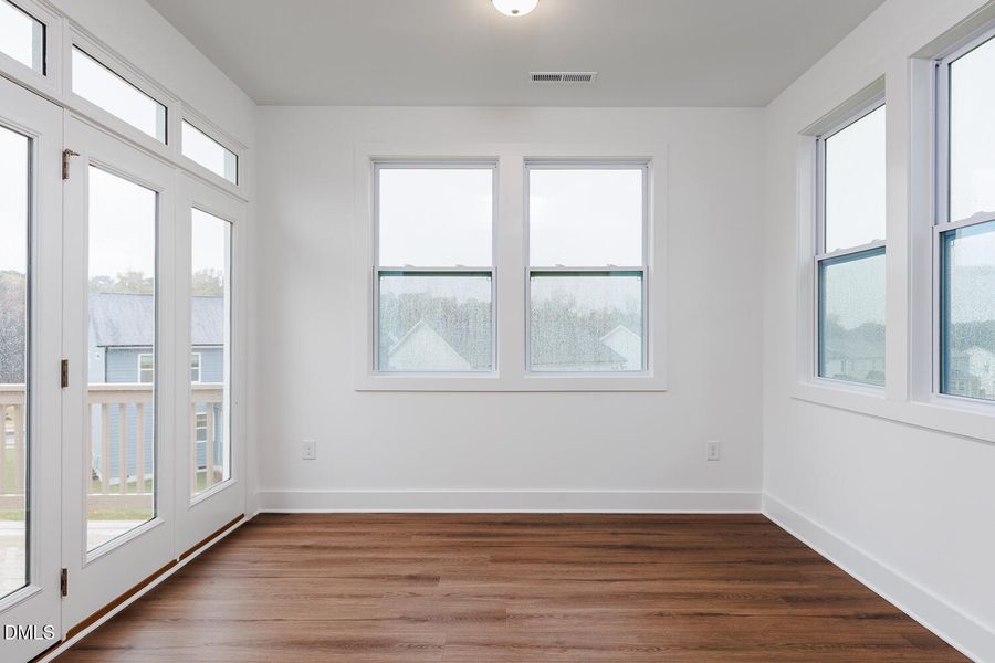 Sunroom with upgraded door to deck