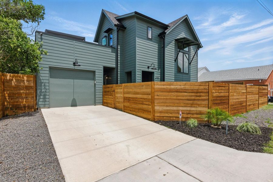 Modern home with driveway and a garage Modern home with driveway and a garage